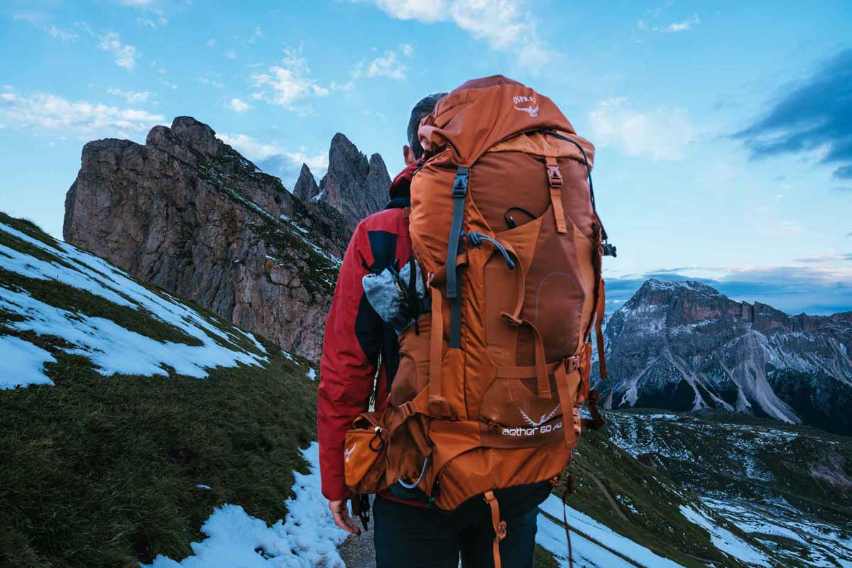 Backpacker wearing a large internal frame pack