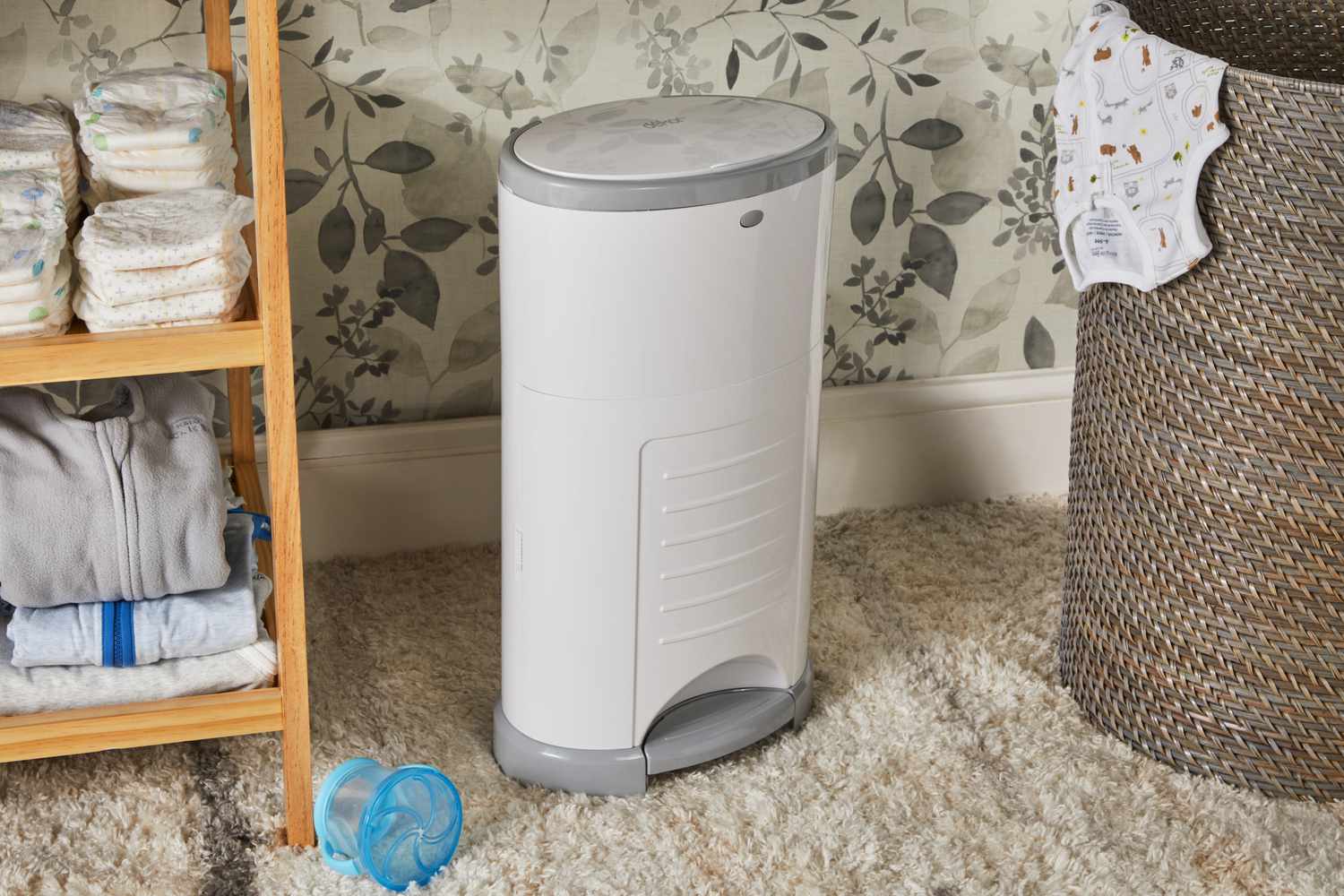 Dekor Plus Hands-Free Diaper Pail displayed on carpet